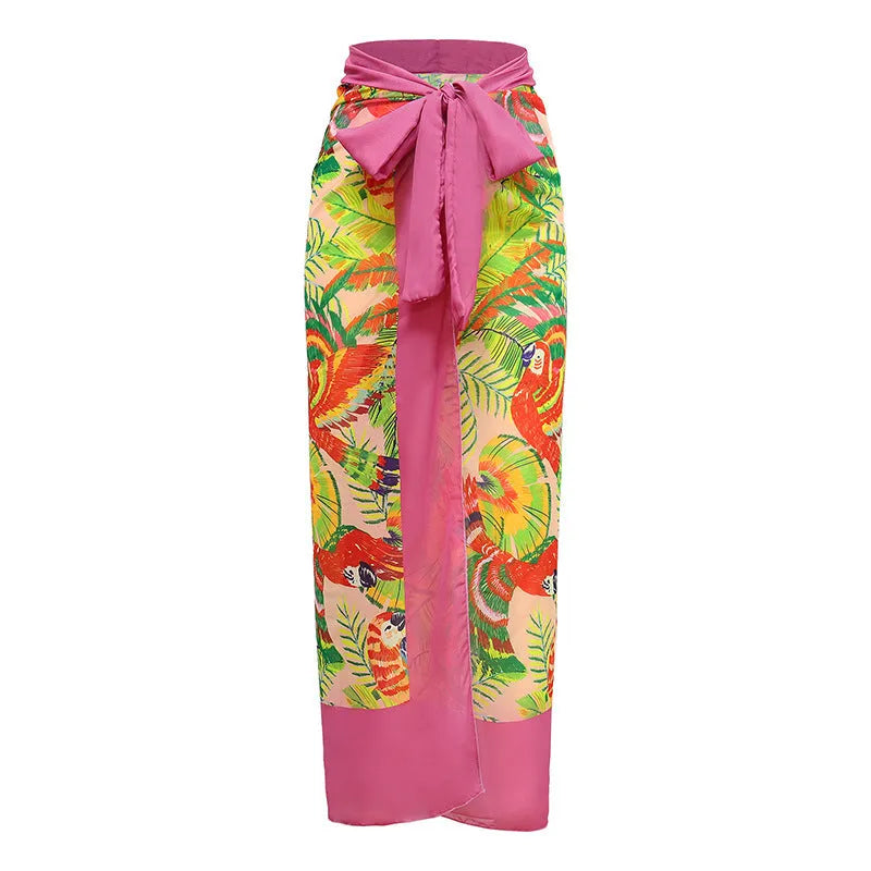 Pink floral print women's V-neck one-piece swimsuit with an attached skirt cover