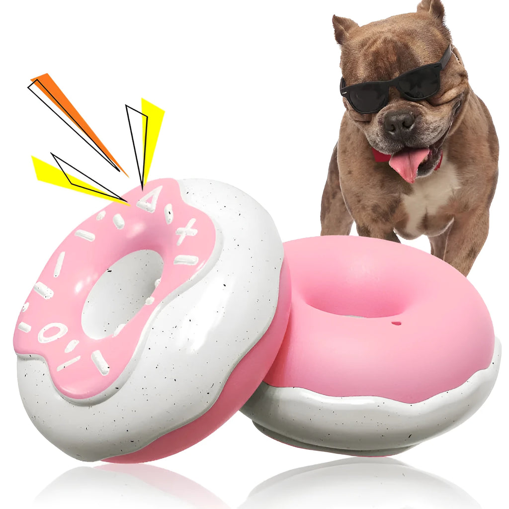 Pink donut-shaped dog chew toy with textured surface for teeth cleaning