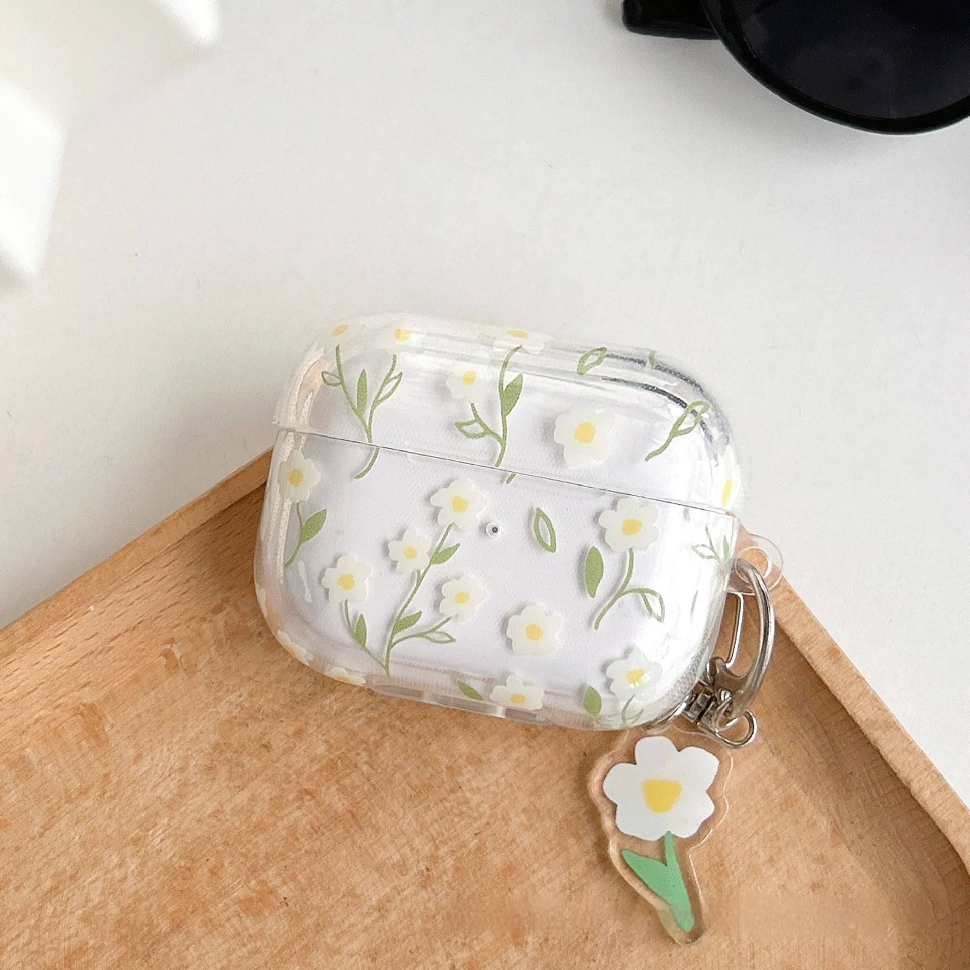 White floral transparent TPU protective case for Apple AirPods showing floral pattern details