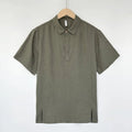 Men's light linen short sleeve top with thin lapels in a loose fit, shown in gray green.