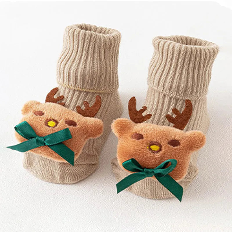 Cotton baby socks in multiple colours and prints including panda, lion, bows, and stars on a white background.