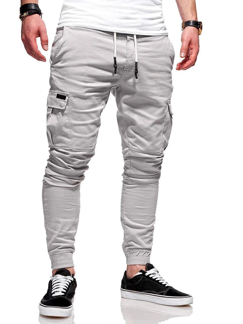 Men's casual straight-leg trousers with patch pockets in polyester fabric, available in seven colours with elastic waistband