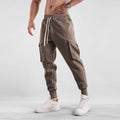 Men's loose cotton sports trousers with ankle ties and multiple pockets in various colour options