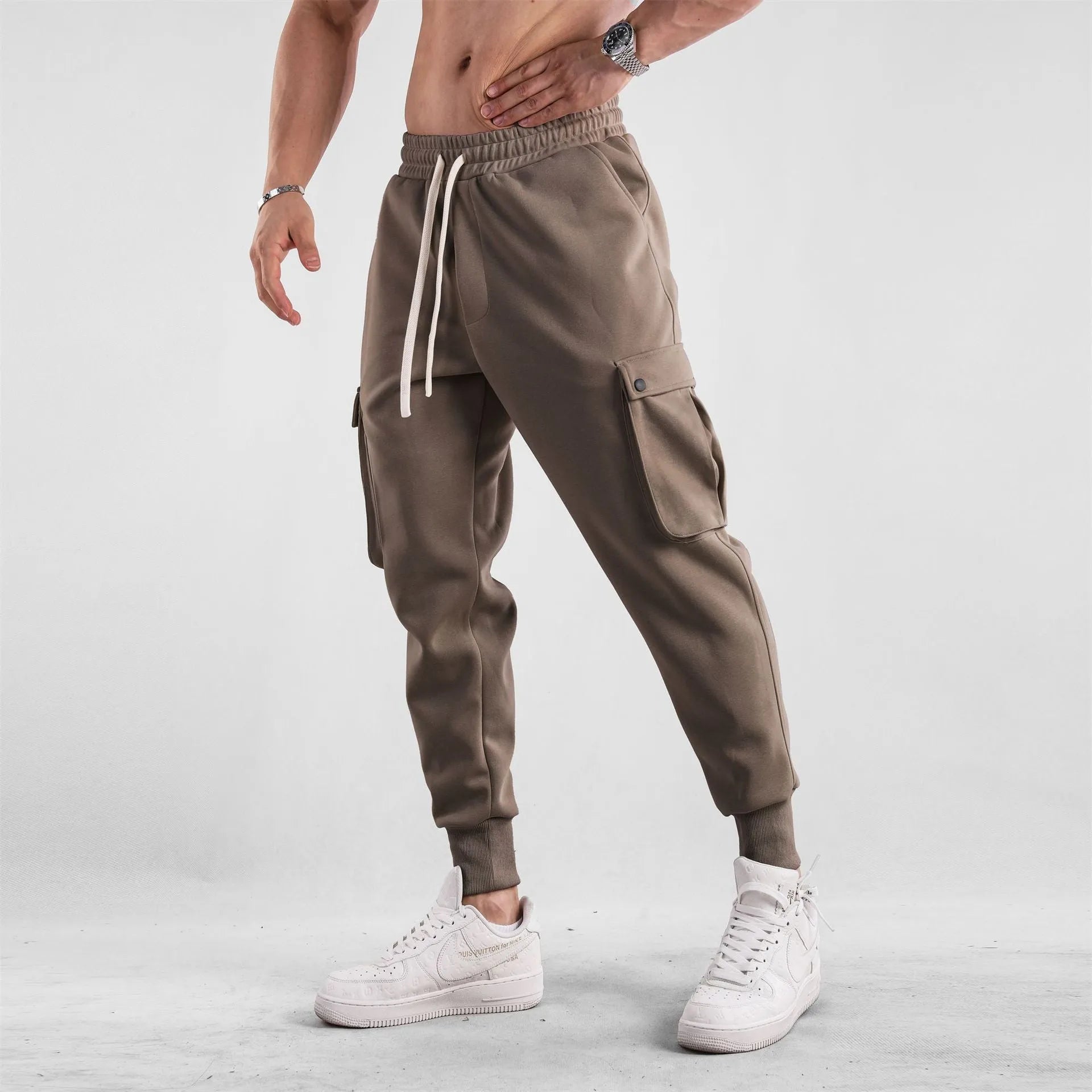Men's loose cotton sports trousers with ankle ties and multiple pockets in various colour options