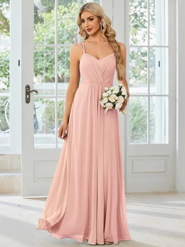 Women's light green sleeveless banquet dress with pleated A-line long skirt on a mannequin.