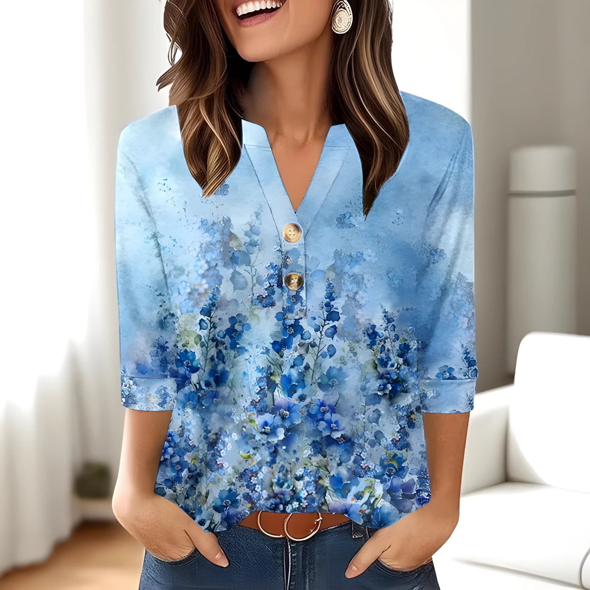 Women's loose-fit V-neck t-shirt with a blue 3D geometric print pattern.