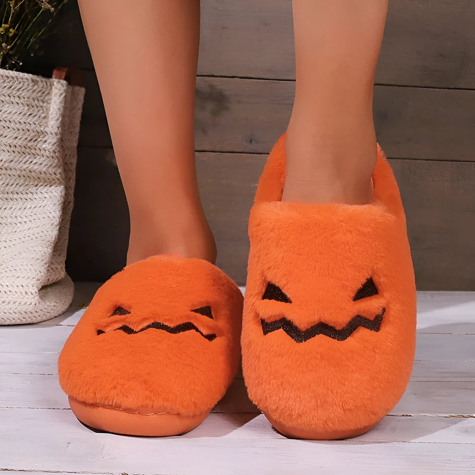 Orange Halloween pumpkin slippers with plush lining and textured coral velvet uppers