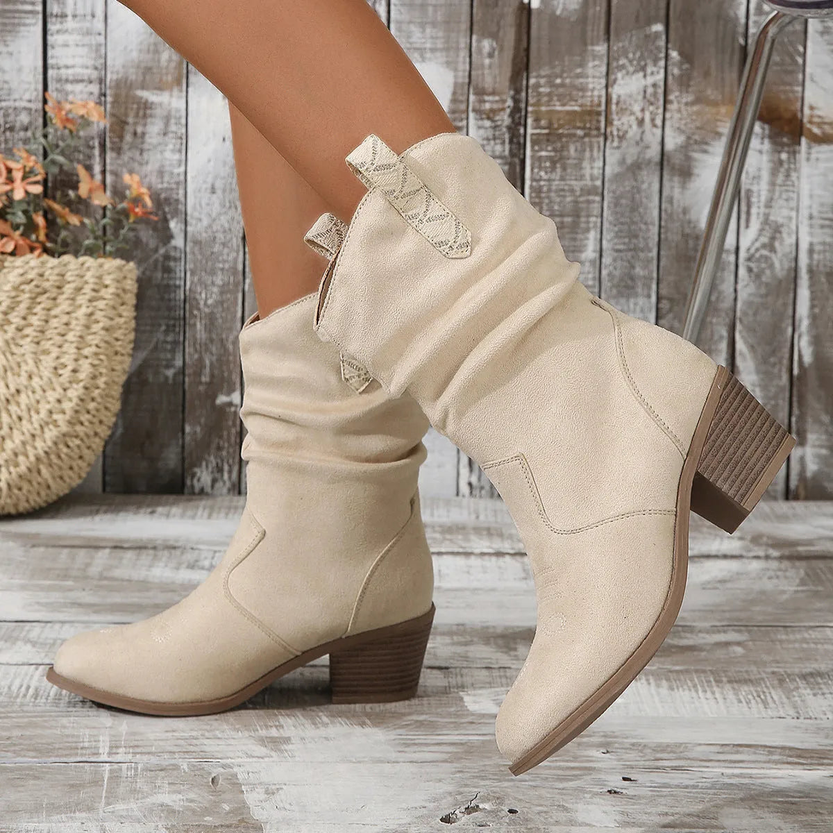 Women's suede mid-calf boots with chunky rubber sole in lotus root colour showing leather stitch detailing