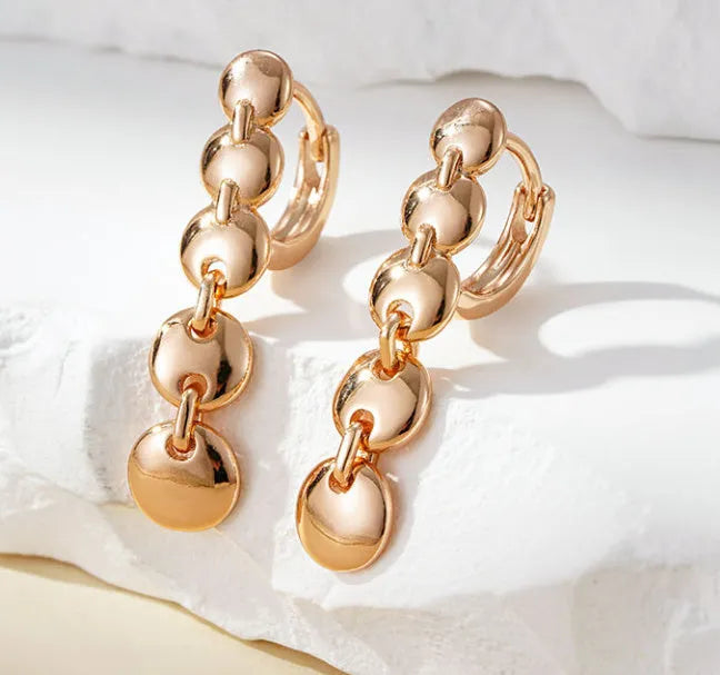 Gold-coloured copper retro earrings with woven texture in long round circle shape