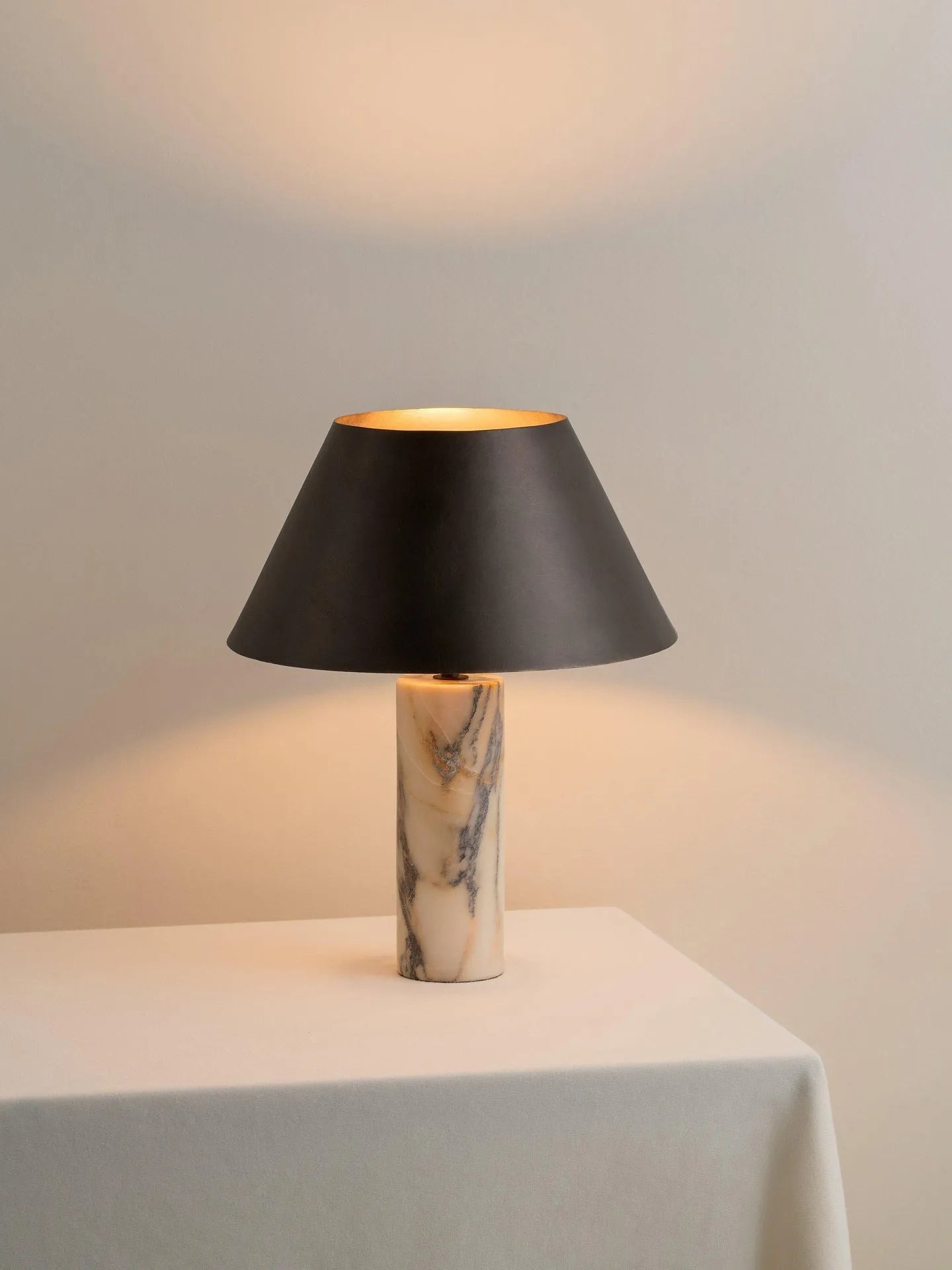 Black marble modern table lamp on a wooden surface with EU and US plug options.