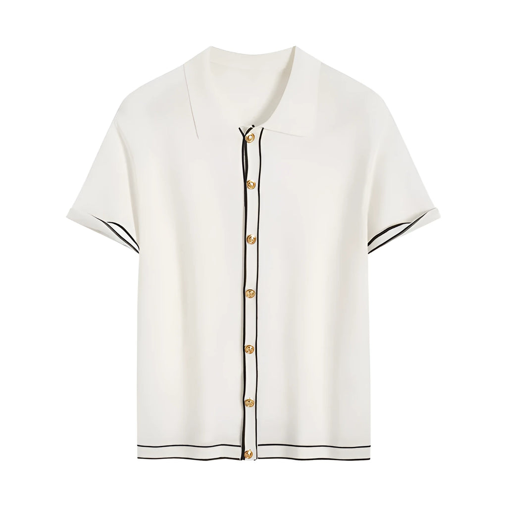 White cardigan with dark contrast lapels and short sleeves, laid flat.