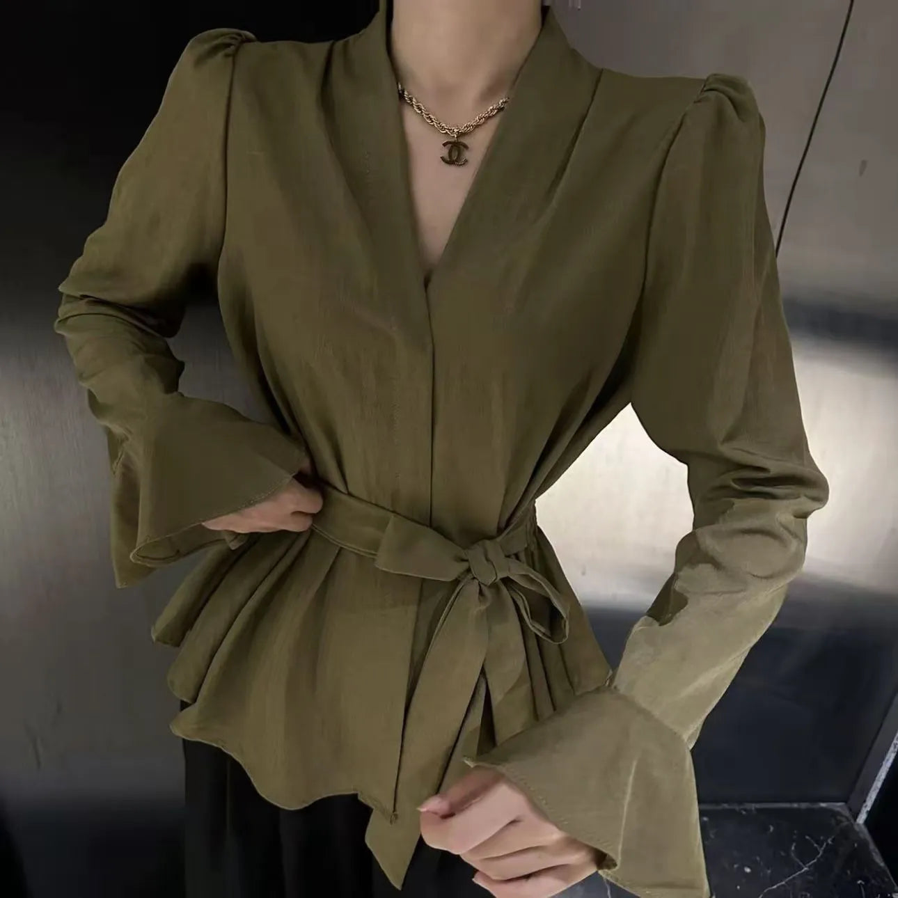 Women's French-style irregular collar tied shirt with bell sleeves in a choice of colours.