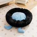 Blue plush kennel sleeping mat for small dog with raised edges, shown on a wooden floor.