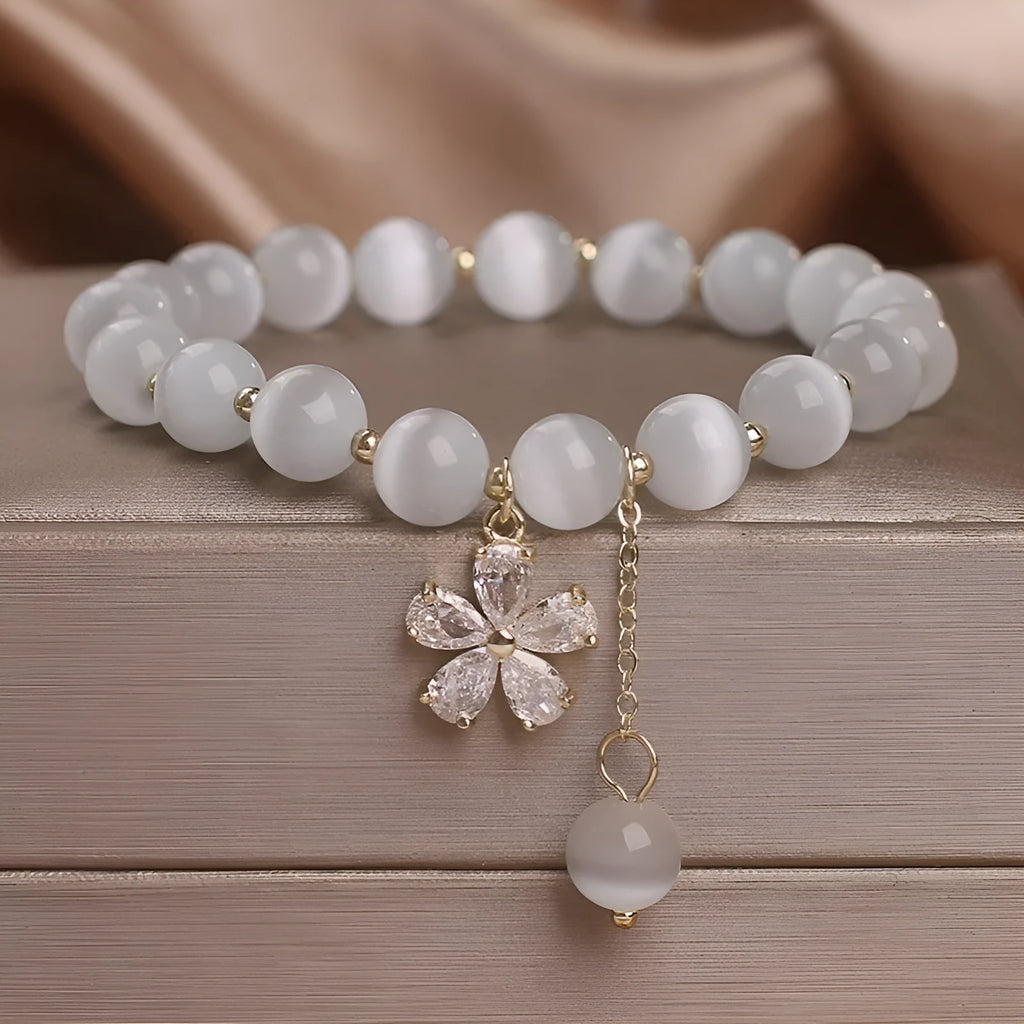 Women's white cat's eye stone bracelet with morganite safety buckle and flower tassel decoration