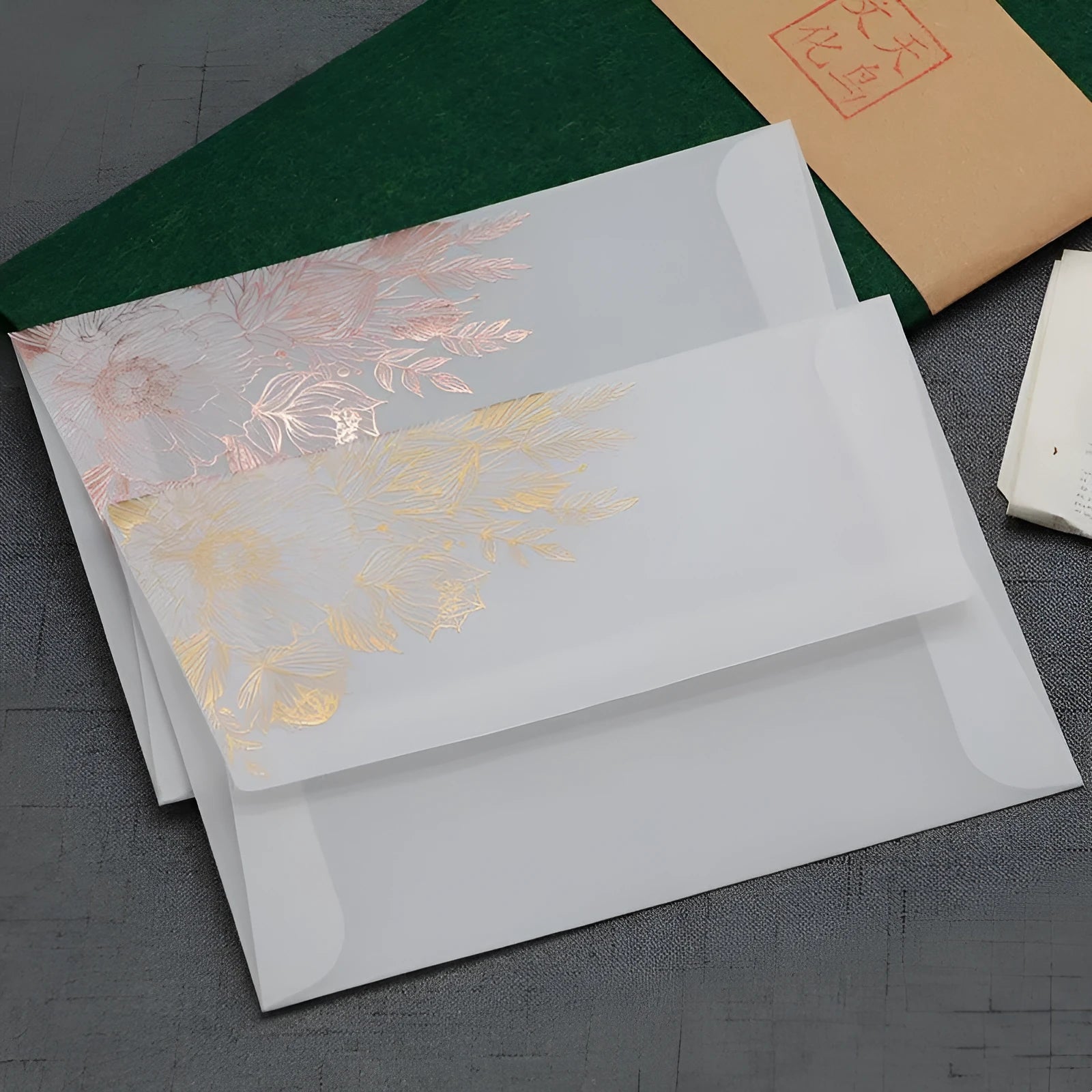Gold bronzed sulfuric acid paper invitation card with matte finish measuring 12.5 by 17.6 centimetres