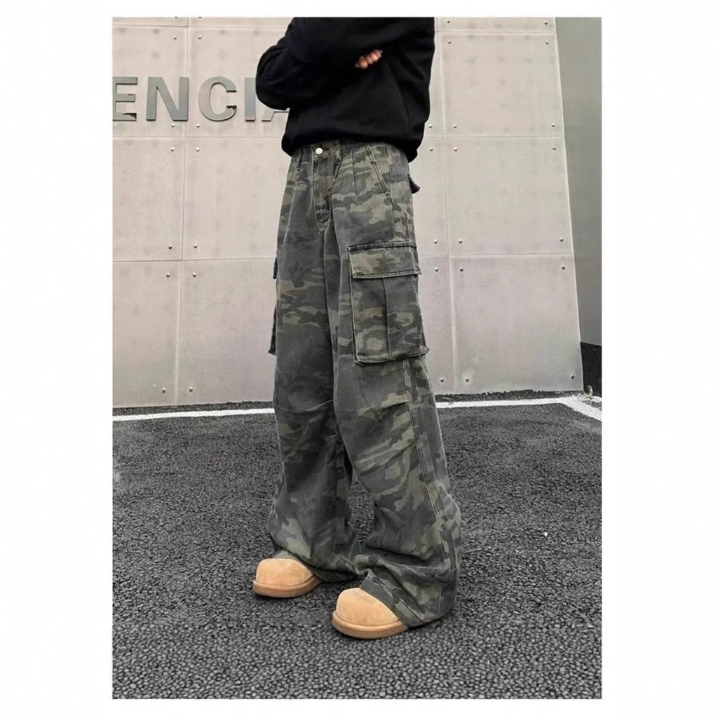 Korean style washed camouflage cargo trousers on a hanger, showing multiple pockets and mid waist design.