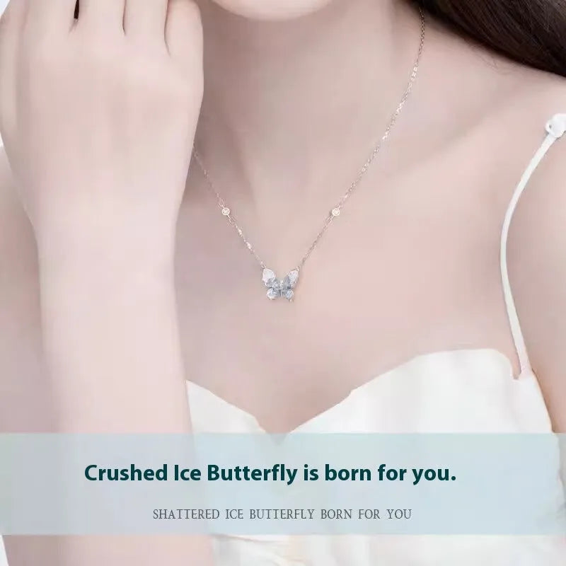 Close-up of a silver butterfly pendant necklace on an adjustable O-ring chain, showing detailed ice rain design.