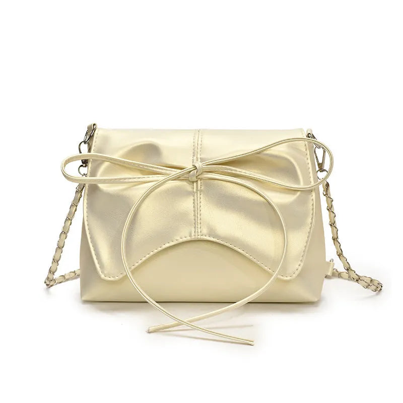 Women's black underarm bag in horizontal square shape showing sandwich pocket design and crossbody strap