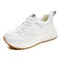 Beige women's low-top casual sports shoes made of cowhide leather with a cross-strap and English muffin heel.
