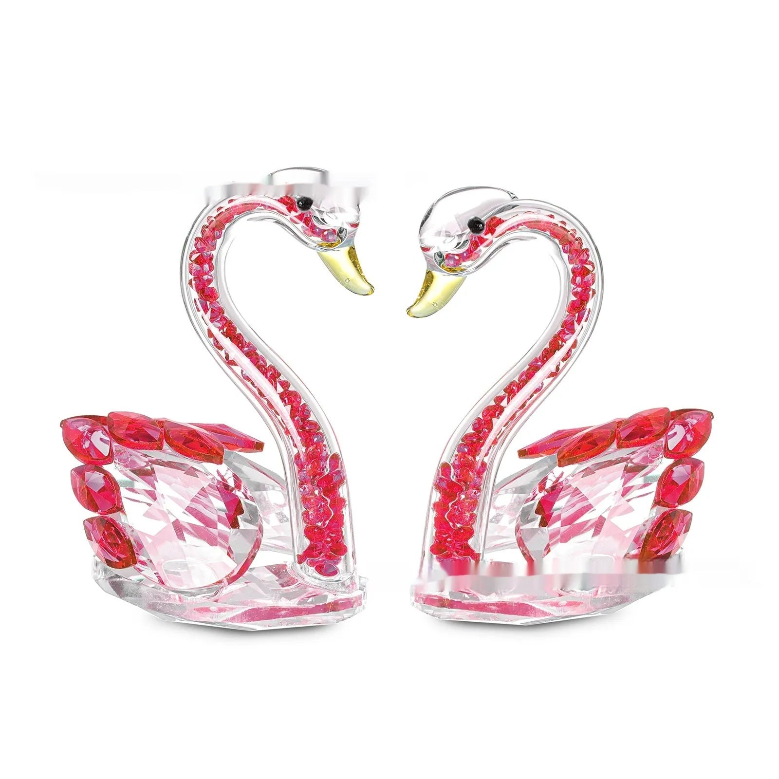 White crystal swan decoration on a desktop in solid head and empty tube styles.