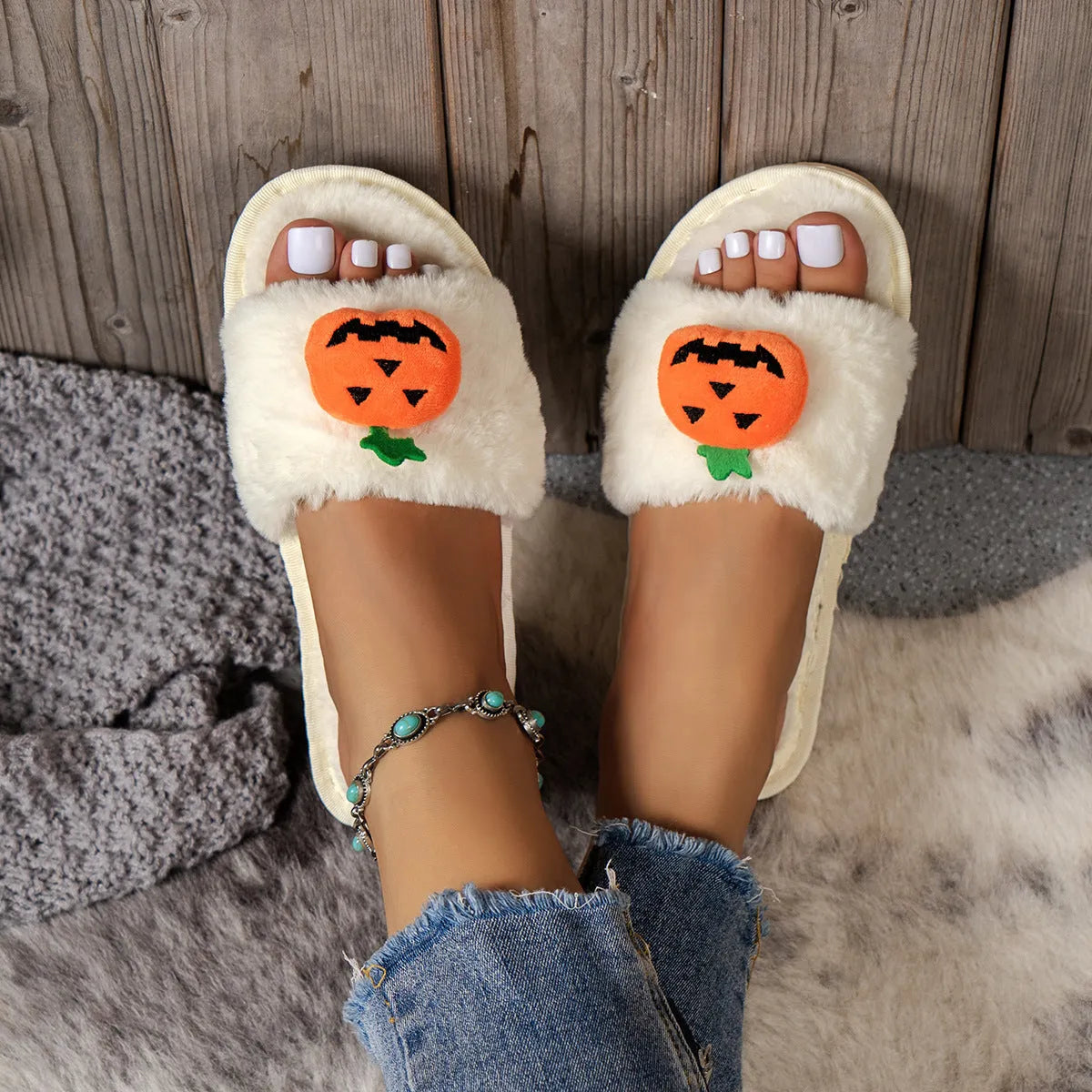 Yellow pumpkin cartoon design open-toe slippers with plush synthetic fur upper.