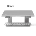 Black aluminium alloy laptop stand on a desk, showing its raised platform and dimensions.