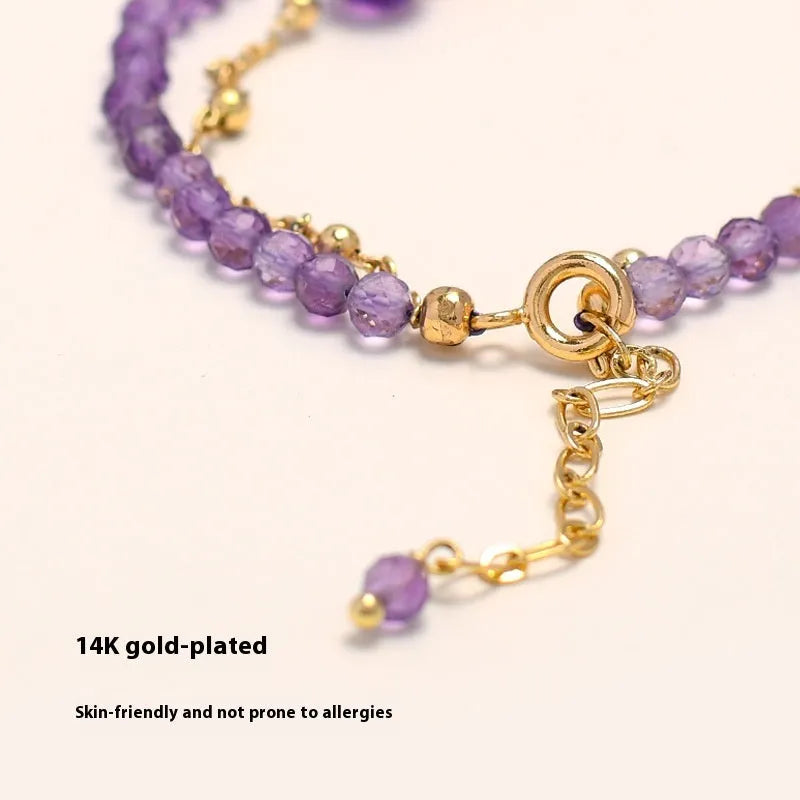Chinese style women's bracelet with amethyst-coloured diamond-shaped crystals in electroplated metal setting