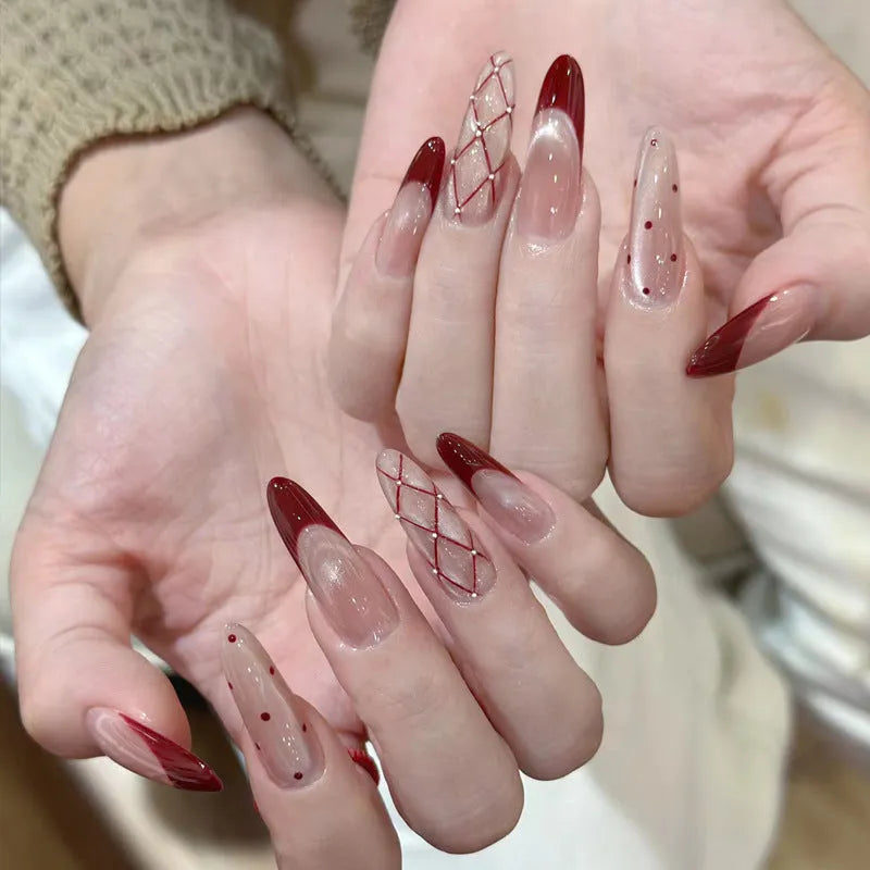 Set of colourful artificial false nails with glitter designs for DIY manicures.
