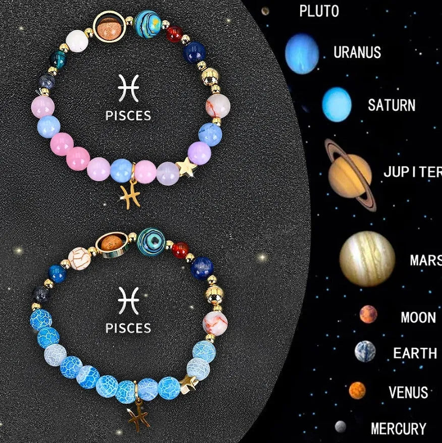 Two natural stone beaded bracelets showing zodiac sign designs on a wooden surface.