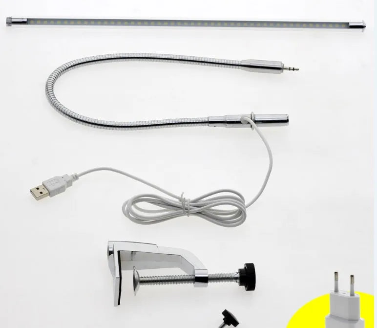 Silver aluminium alloy LED clip-on table lamp with long adjustable arm for nail art lighting.