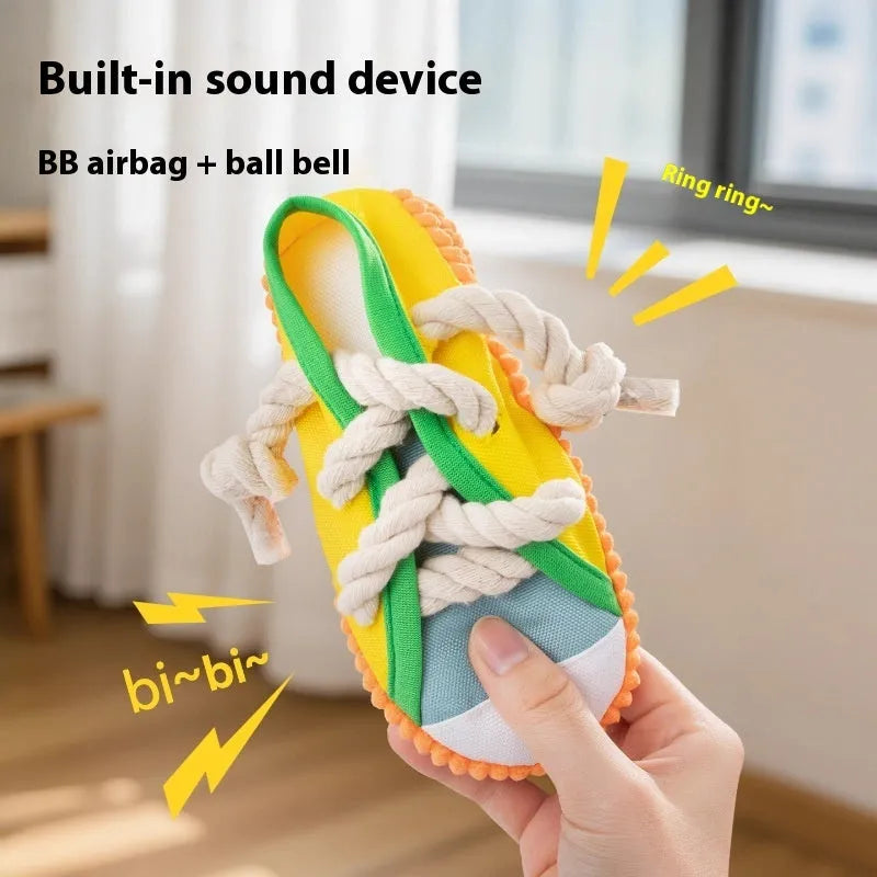 Flexible plastic dog chew toy shaped like a slipper in yellow, with a bendable design and sound chip.