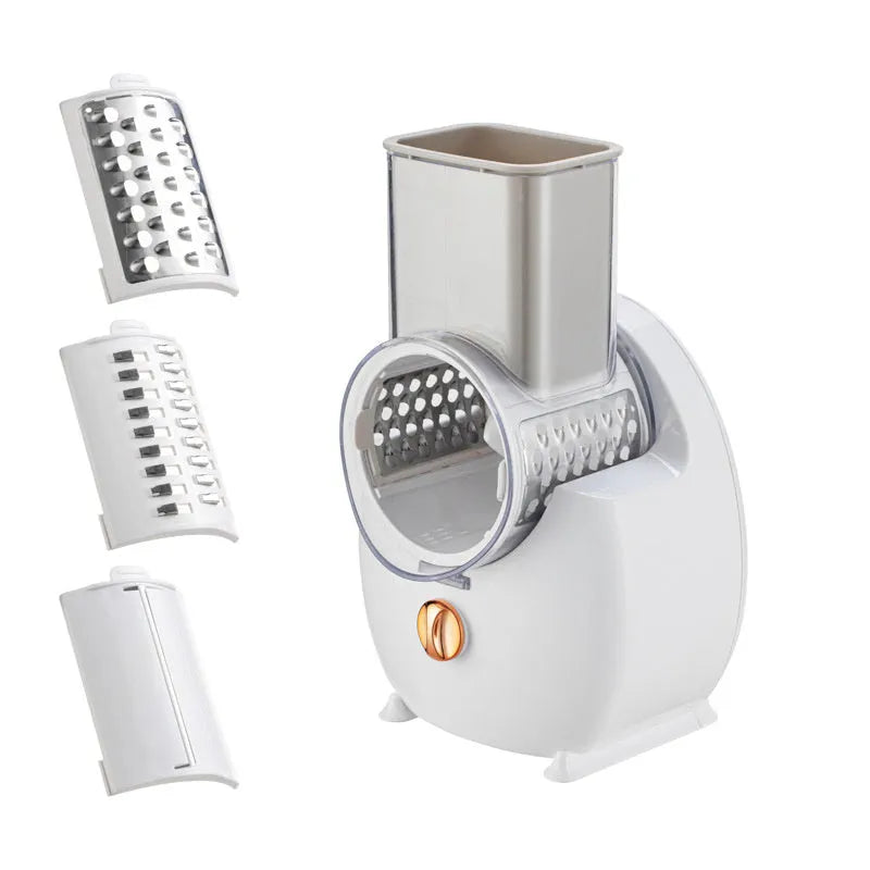 White and green electric vegetable slicer with suction base, feeding port, and multiple blades.