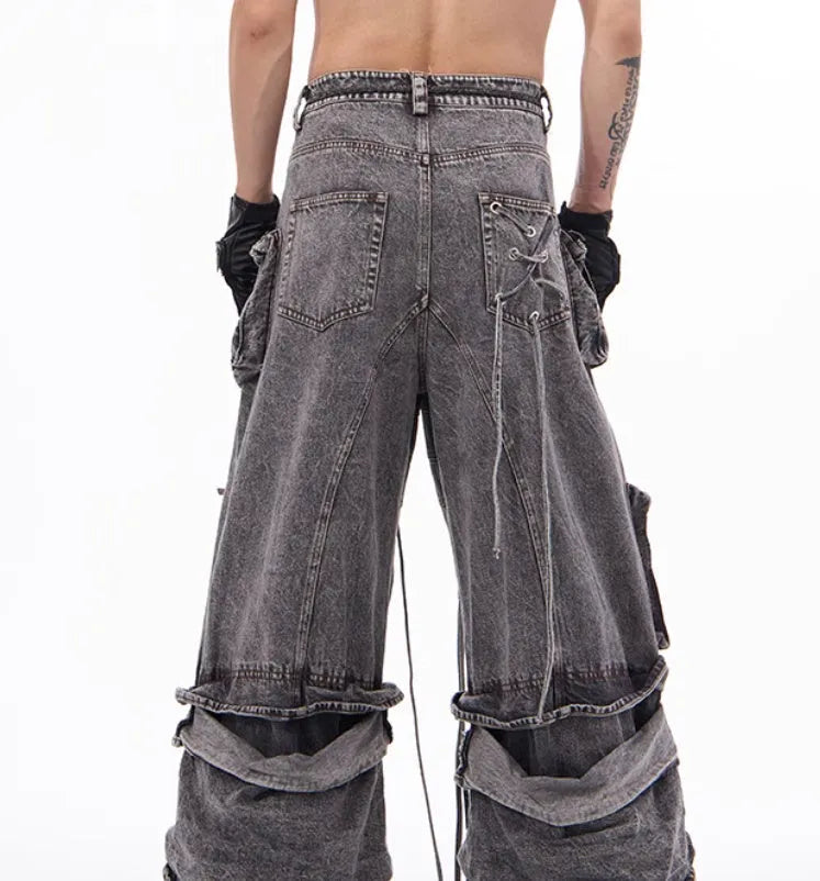 Grey distressed denim overalls with rope stitching detail on front