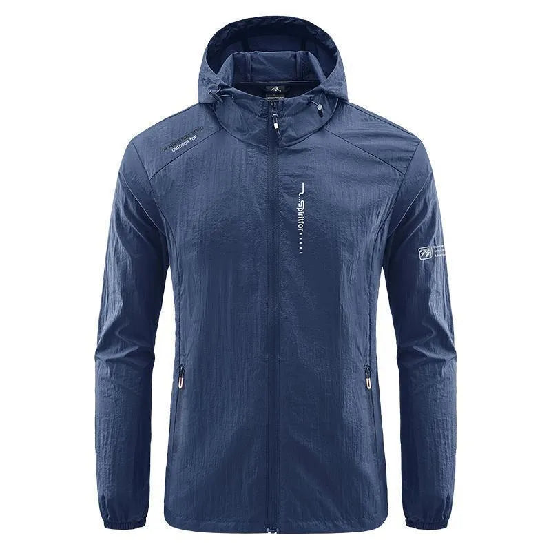 Man wearing a light grey loose-fitting hooded nylon summer jacket for sun protection.