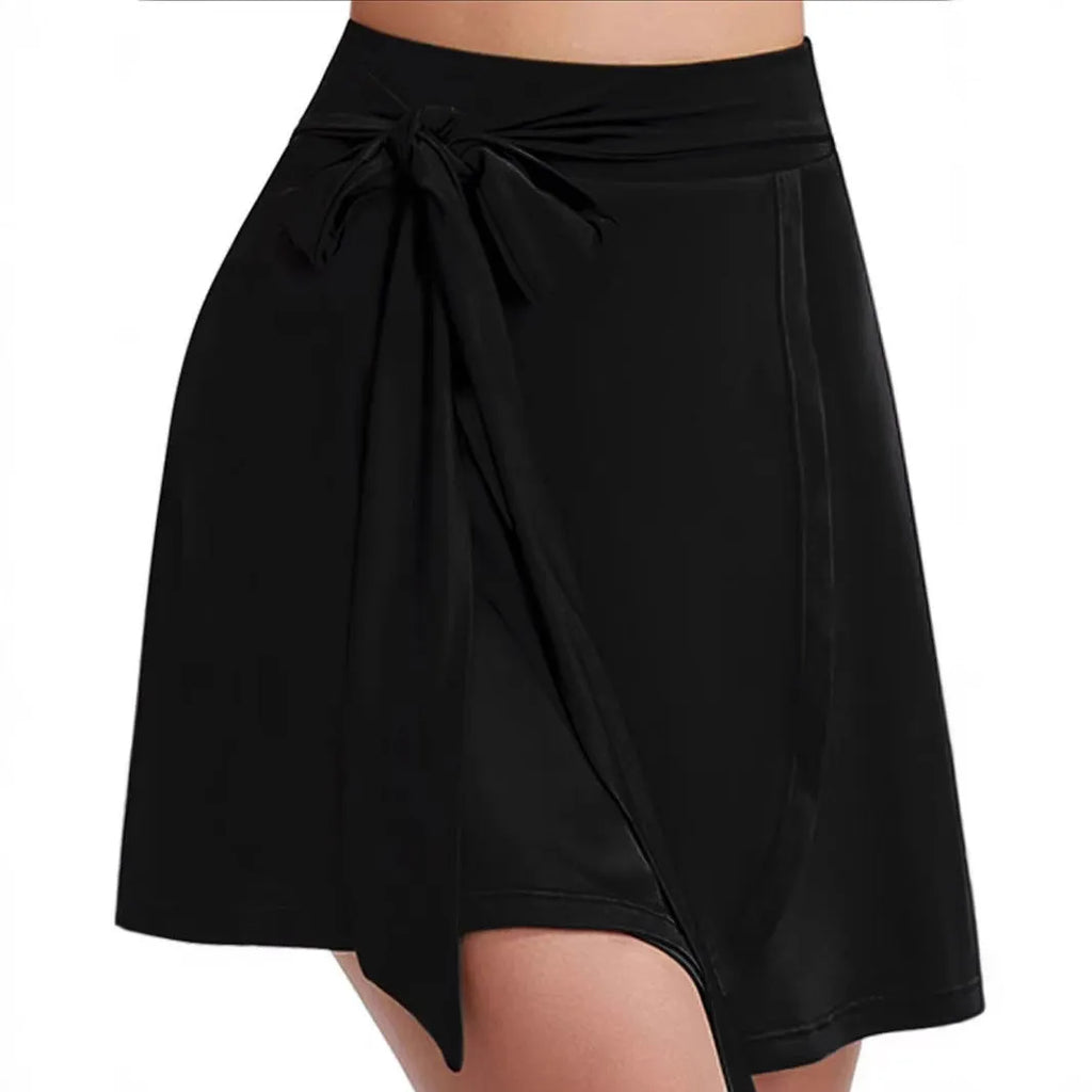 Black thigh-length anti-exposure sports skirt with built-in shorts and shoulder strap detail