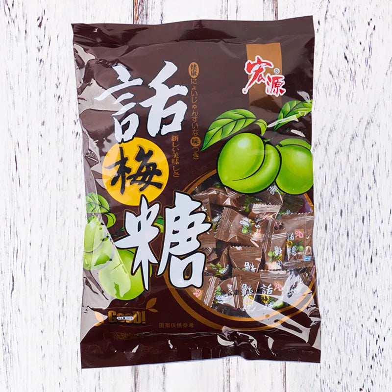 Three bags of hard candy: plum sugar, guava, and tangerine peel flavours.