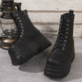 Women's black platform ankle boots with a chunky heel and side zipper on a white background.