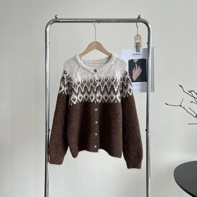 Women's beige jacquard knit sweater coat with contrast pattern, shown on a hanger.