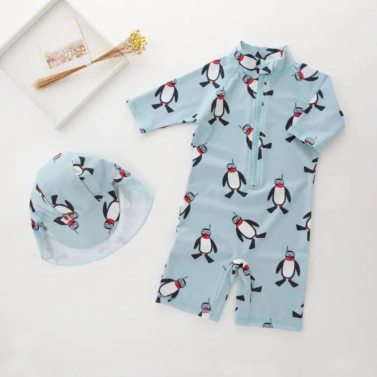 Boy's penguin print long sleeve swimsuit two-piece set with matching swimming cap
