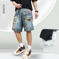 Blue men's ripped denim shorts with graffiti detailing and a straight-leg cut, showing front zipper fly.