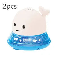 Blue and white whale bath toy with water spray and flashing lights for baby sensory play