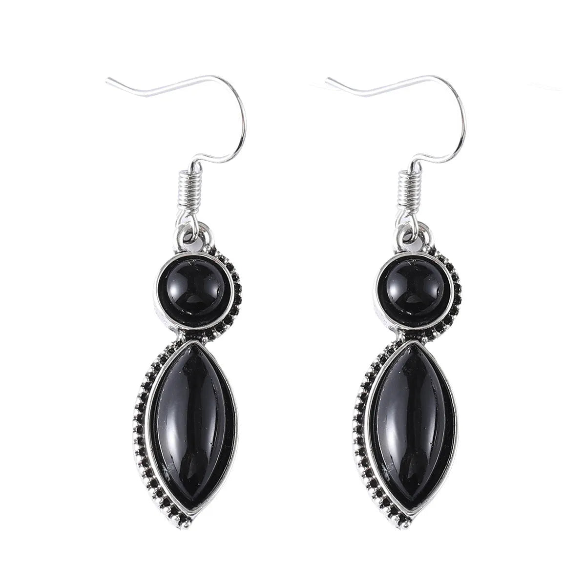A pair of geometric vintage pendant earrings in black and purple colours with a bohemian style.