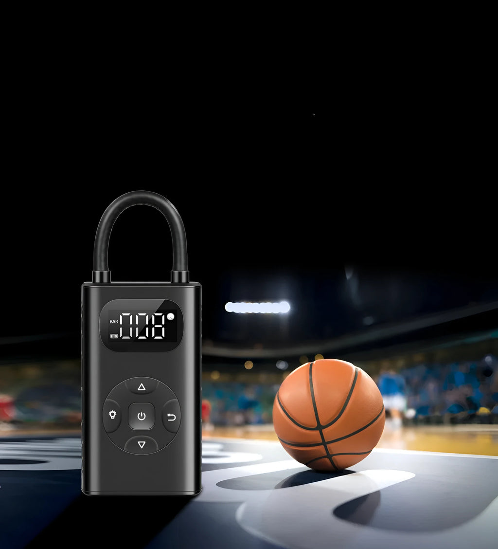 Black M09X portable power bank tyre inflator with 16cm tube next to car and motorcycle tyres