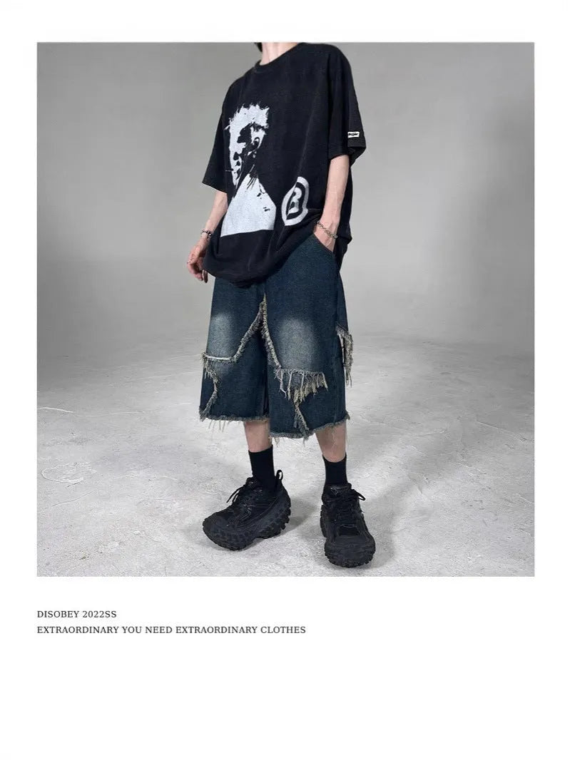 Blue denim shorts with frayed five-pointed star design and loose fit