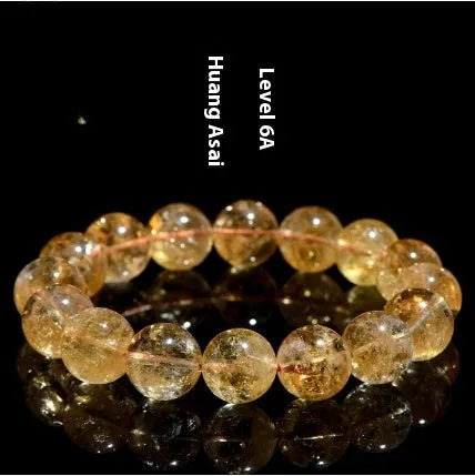 Natural yellow citrine gemstone bracelet showing geometric beads on a string.