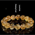 Natural yellow citrine gemstone bracelet showing geometric beads on a string.