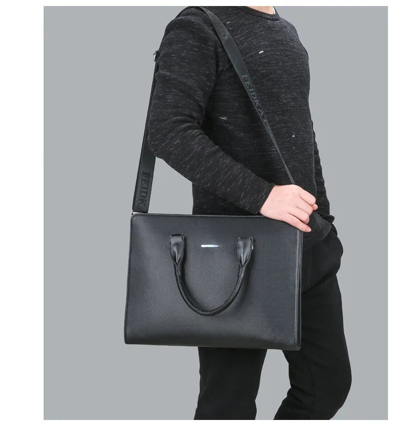 One-shoulder cross-slung male business briefcase in PU leather, horizontal square shape, black colour, zipper closure, stitched detailing