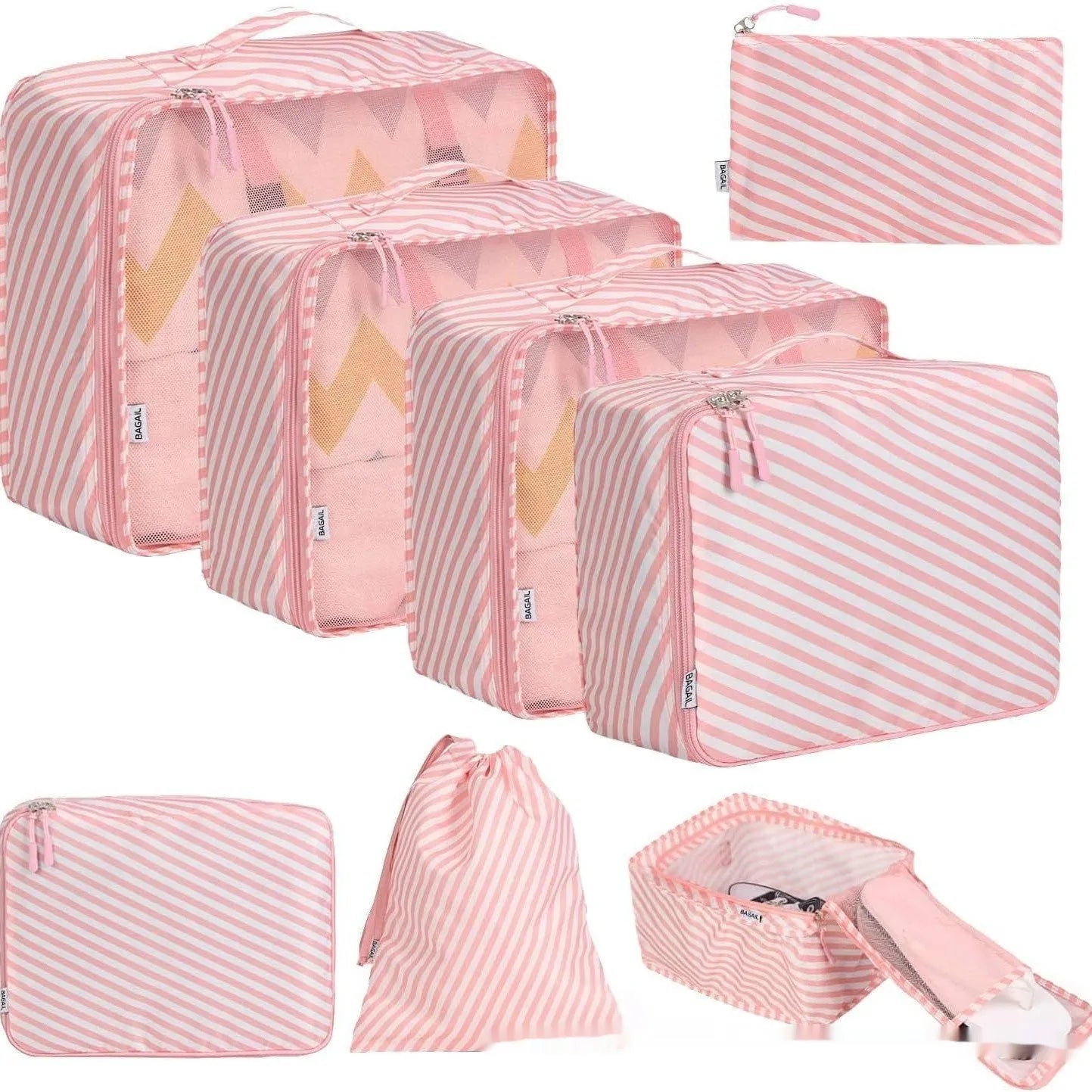 Eight cubic travel packing bags in various colours including beige, black, pink leopard print, and white pink stripes