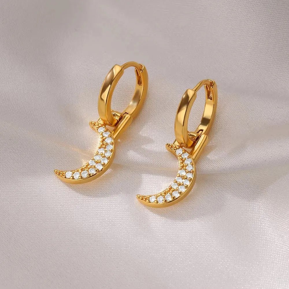 Geometric copper butterfly earrings with a heart, bow, and star details in a selection of colour finishes.