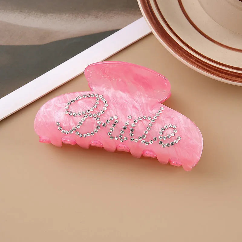 Acrylic hair clip with spot drill decoration in pink or white, 10cm long.
